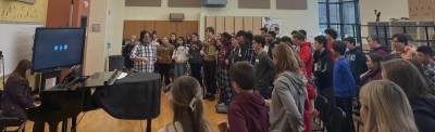 Director Matthew Chi Lee works with the Sussex County Chorus in the Sparta High School chorus room. (Photo provided)