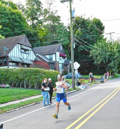 Mark Minervini, 31, of Stanhope wins the 5K. His time was 17:15.67.