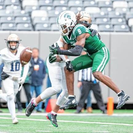 Pope John’s Andrew Sanchez breaks up a long pass intended for DePaul’s De’zie Jones.