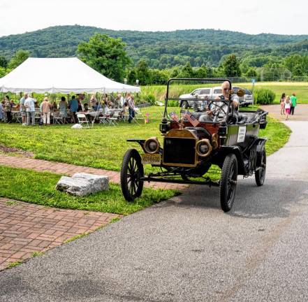 Joe Warner offers Model T rides during the party.