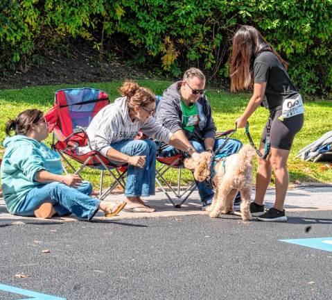 DS2 Parade watchers pet a participant in the Lake Mohawk Country Club’s annual Dog Show &amp; Parade on Sunday, Sept. 22 in Sparta. (Photos by Nancy Madacsi)