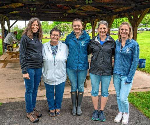 Jeanne Montemarano, Alison Deeney, Kelly Giannantonio, Janice Williams and Emily Fisher, members of Sparta’s Parks &amp; Recreation Department staff, help with the Trout Derby.