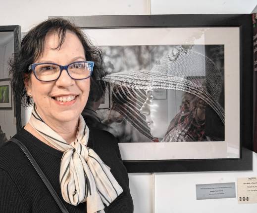 Lisa Burghart with her photo ‘Girl With a Pearl Earring,’ which won the People/Pets Award.