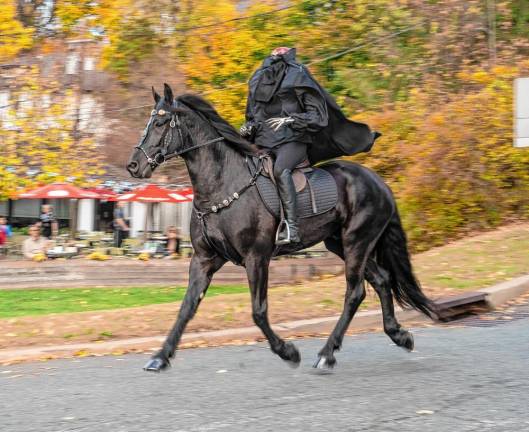 The Headless Horseman rides through Sparta on Halloween.