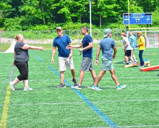 Players shake hands with their opponents.