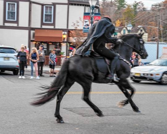 The Headless Horseman rides through Sparta on Halloween. (Photos by Nancy Madacsi)