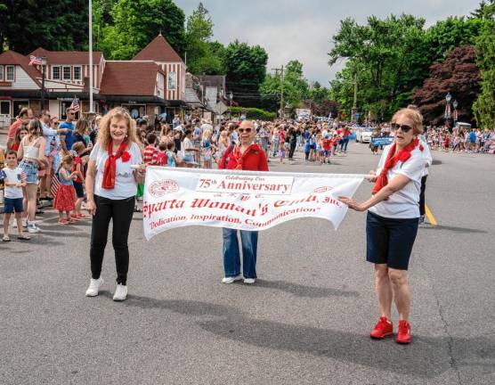 Members of the Sparta Woman’s Club march in the parade.