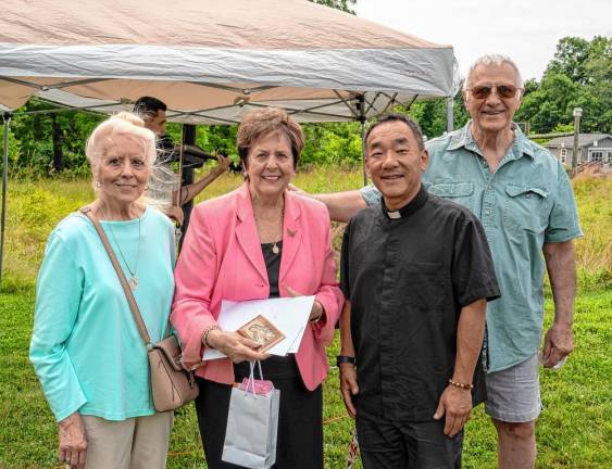 From left, Kathleen Fitzsimmons, Marjorie Strohsahl, Father Mike Lee and Charles Garzik.