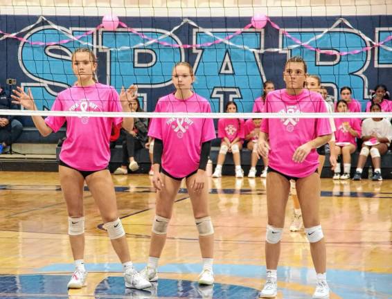 Sparta volleyball players Sylvia Przydzial, Aralyn Saulys and Arielle Gomez stand ready for action.