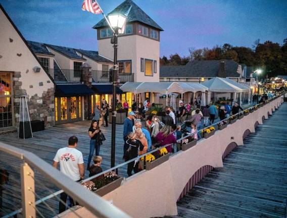 People gather to watch the sunset Wednesday, Oct. 30 on the Boardwalk in Sparta. (Photo by Nancy Madacsi)