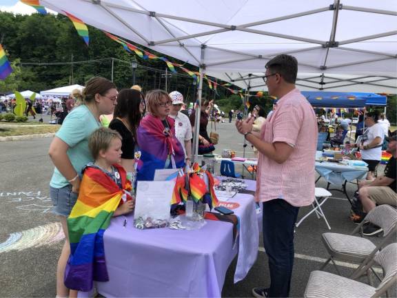 Todd Gillespie of PFLAG Sussex County answers questions from visitors.