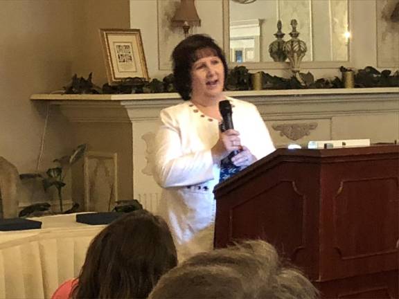 PIX2 Becky Carlson, executive director of the Center for Prevention &amp; Counseling in Newton, speaks at the chamber luncheon. (Photo by Kathy Shwiff)