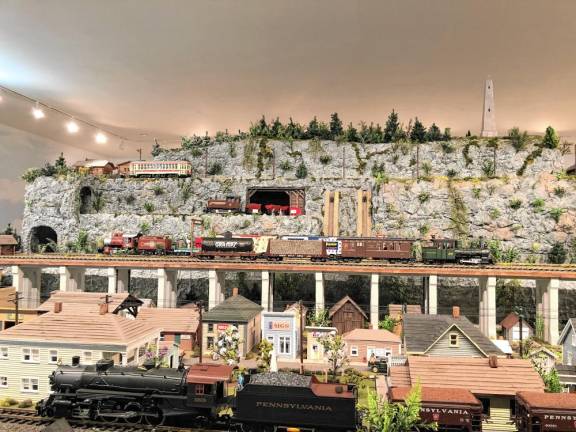 Trains run on multiple tracks at three different levels at the Friar Mountain Model Railroad Museum in Sparta.