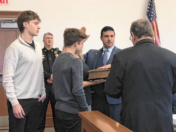 Chris Carney is sworn in as director of the Sussex County Board of County Commissioners on Wednesday, Jan. 1. He also was sworn in to his second term on the board.