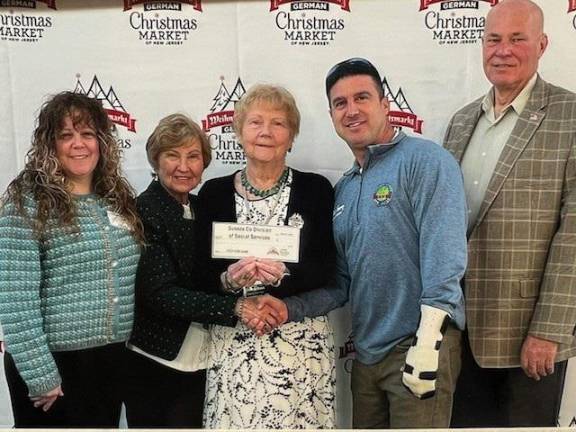 <b>From left are Christine Florio, Sussex County Health and Human Services administrator; Karin Meyer and Gundrun Rank, both founders of the German Christmas Market of New Jersey; Chris Carney, Sussex County Board of County Commissioners director; and Commissioner Alan Henderson. The county Division of Social Services received a $2,000 grant from the market to support its food pantry. (Photo provided)</b>