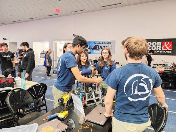 RO1 Mahanth Chintha, co-captain of Sparta High School Robotics lead varsity team 5249 Z ‘Mirage,’ adjusts the robot. (Photos provided)