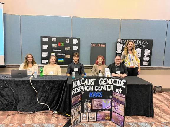 Mary Houghtaling with Kittatinny Regional High School students in the school’s Holocaust and Genocide Research Center.