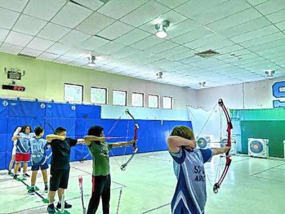 The archery team at Helen Morgan School practices.