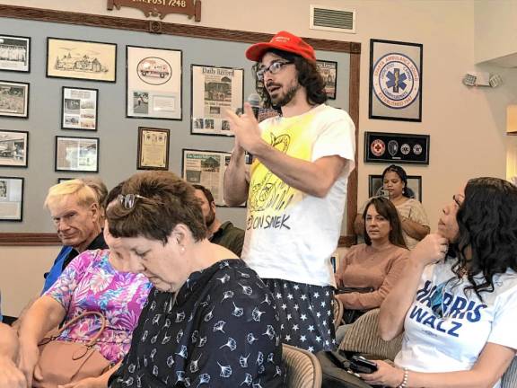 A resident asks Sue Altman a question during the town hall meeting.