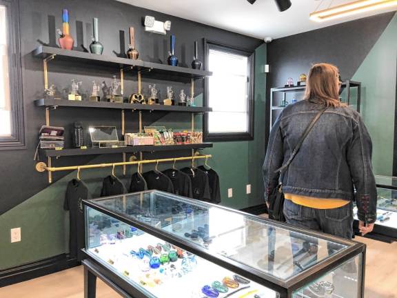 A shopper browses at the Jersey Roots dispensary, which officially opened April 20 in West Milford. (Photo by Kathy Shwiff)