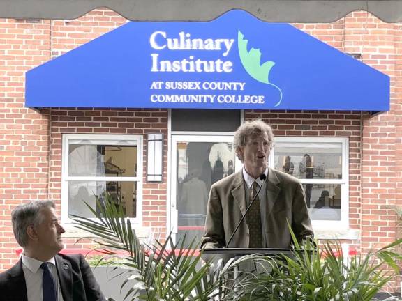 SCCC president Jon Connolly speaks before the ribbon-cutting. At left is Stan Kula, executive director of the SCCC Foundation.