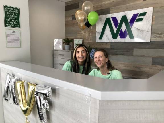 CA2 Amanda Viglione, left, and Melissa Jung work the front desk of Mountain View Farmacy. The cannabis retailer held its grand opening Sunday, July 30.