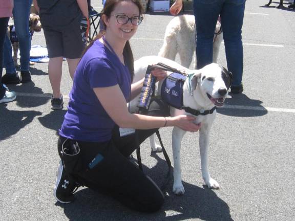 Ollie, a therapy dog, and his owner attend Pet Lovers Fest.