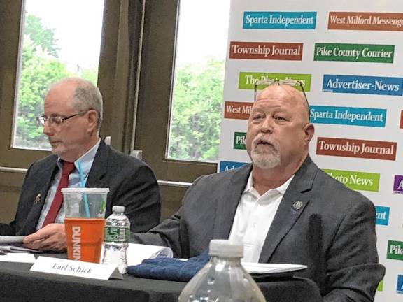 Earl Schick, right, joined the commissioners board in February. He is running for a full three-year term. At left is candidate Harvey Roseff.