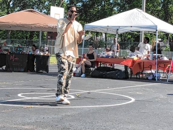 Scott Paul, founder of H3AL, performs at the Juneteenth celebration.