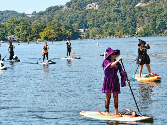 Women dressed as witches take part in the fifth annual Witches Paddle on Sunday, Sept. 15 on Lake Mohawk in Sparta. (Photo by Maria Kovic)