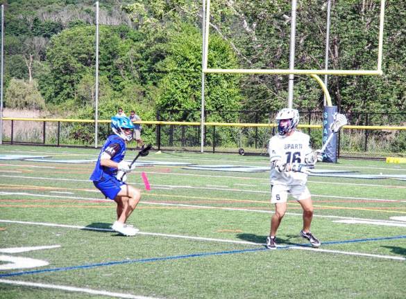 SL3 Sparta's Matt Ciarelli holds the ball with his crosse as Jake Nisivoccia of West Morris moves toward him. Ciarelli scored two goals.