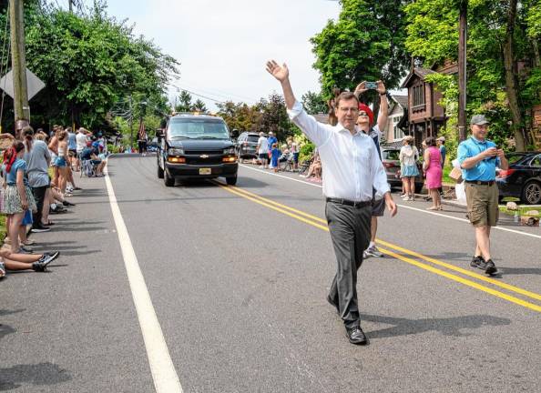 State Assemblyman Mike Inganamort, R-24, waves at the crowd.