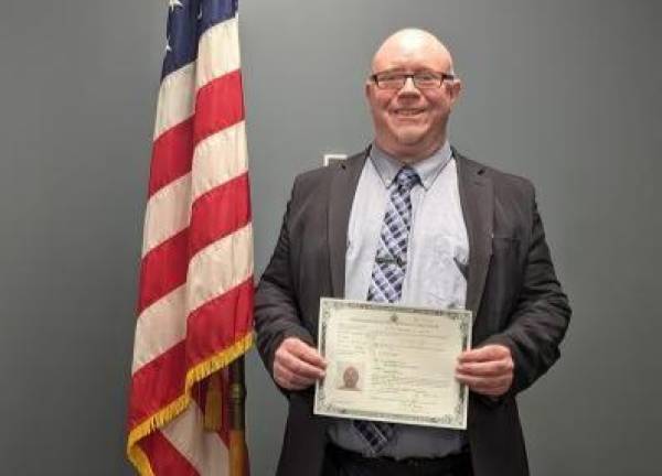 <b>Goshen resident Chris Thurtle at his naturalization ceremony in March.</b>