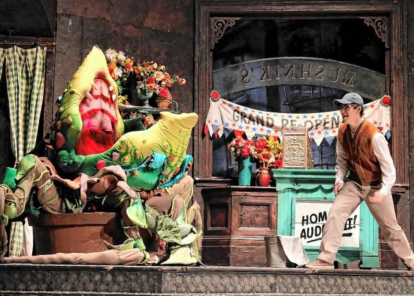 Caiden Loyer plays Seymour Krelborn, a down-on-his-luck florist in ‘Little Shop of Horrors’ on March 14-16 at Sparta High School. Logan Scarpa is the voice of the plant Audrey II, left. (Photos by Paige Lucas)