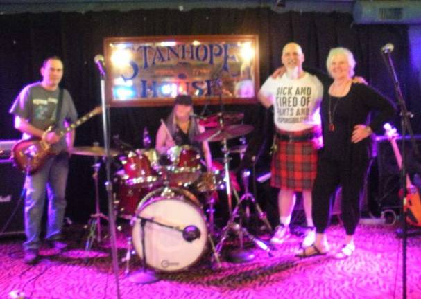 Sparta-based punk band The Bathwater with Project Help Executive Director Sandy Mitchell (R). Photos by Mandy Coriston