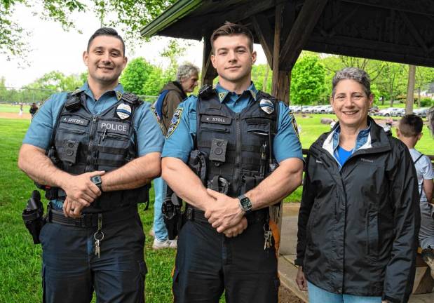 Sparta Patrolmen Andrew Spitzer and Kyle Stoll with Jeanne Montemarano, the township’s director of Parks &amp; Recreation.