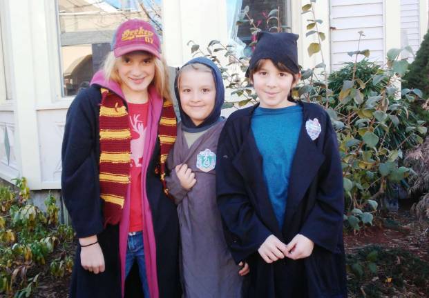 Siblings Abigail, Sam, and James Rabbitt of Newton &#x2013; dressed up as Gryffindor, Slytherin, and Ravenclaw students, respectively.