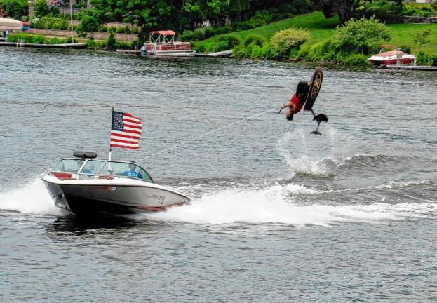 Damon Jenkins flips on his hydrofoil during the Ski Hawks’ show July 4.