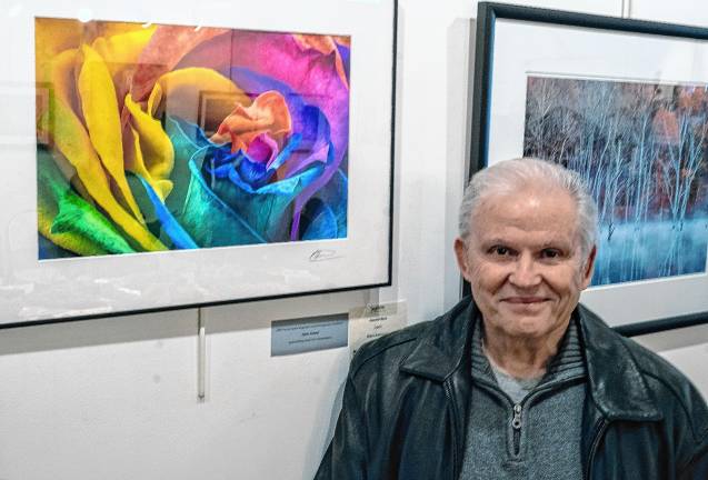 Marv Kaminsky with his photo ‘Painted Rose,’ which won the Open Award.