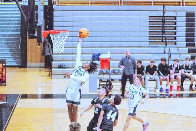 Sparta’s Leshem Little glides through the air during a shot. He scored 28 points, grabbed five rebounds and was credited with one steal.