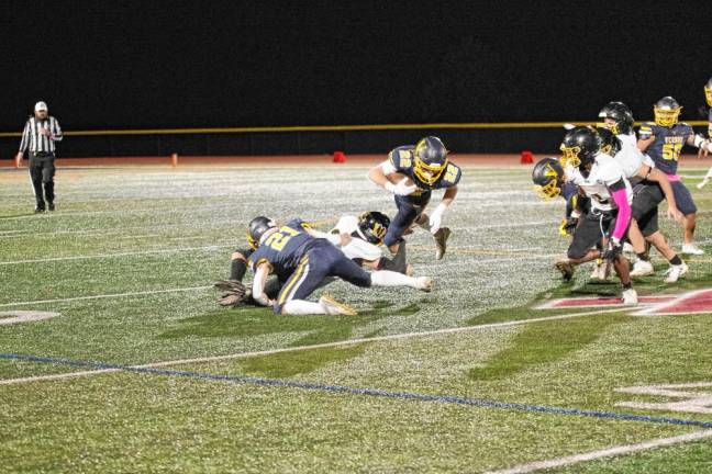 <b>Vernon wideout Gavin Bruno (22) is grabbed by a West Milford defender. </b>