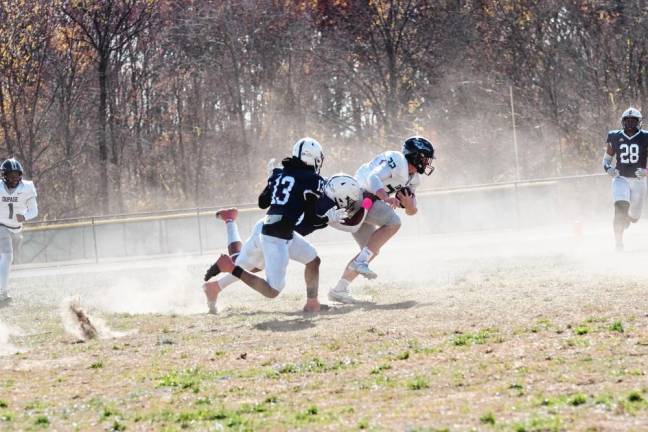 Sussex County defenders pursue a DuPage ball carrier.