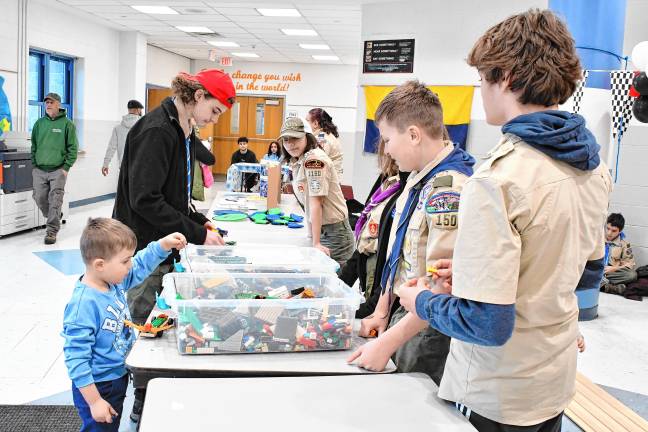 Boy Scouts with Pinewood Derby cars.