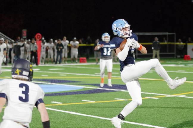 Sparta defensive back Nick Remo intercepts the ball in the first half. Remo also made 3 tackles during the game.