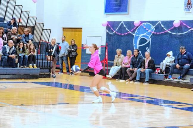 Sparta's Aralyn Saulys in the midst of a serve.