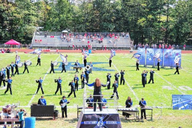 <b>The Kittatinny Regional High School Marching Band and Color Guard perform during halftime.</b>