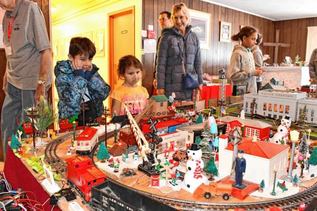 <b>Luke and Maggie Gibson of Oak Ridge look at the Holiday Train Display on Saturday, Nov. 23 at Prince of Peace Lutheran Church in Hamburg. The display was set up by the Sussex County Railroad Club. (Photos by Maria Kovic)</b>