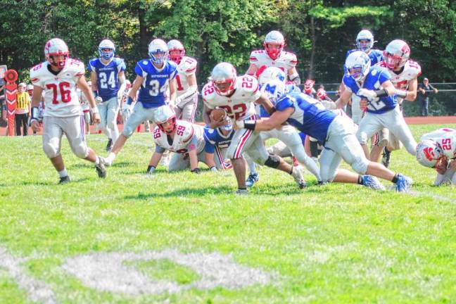 <b>High Point ball carrier Giovoughni Dureny (22) forces his way forward.</b>