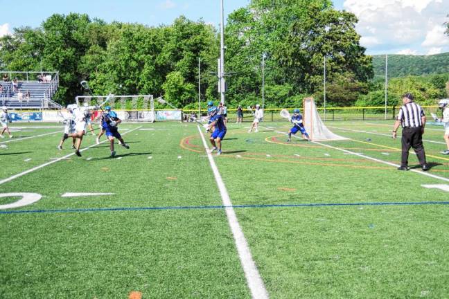 From left, Sparta’s Marco Aquino (5) leaps and launches the ball toward the net, resulting in a goal in the first period. He scored three goals in the game.