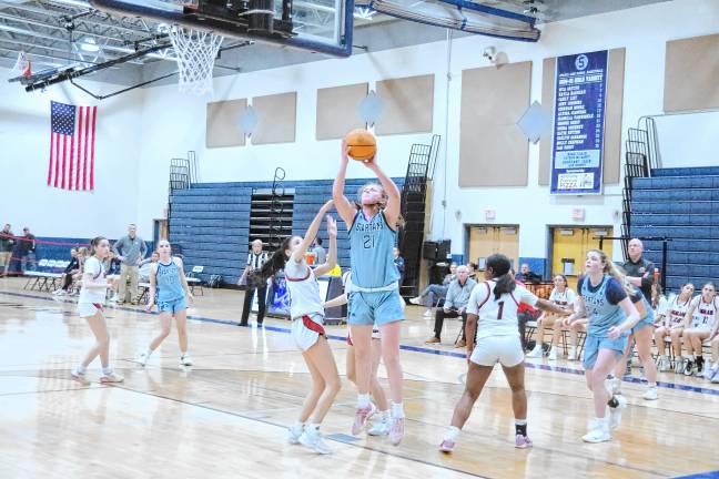 Sparta's Brooke Shust raises the ball toward the hoop. She scored 12 points.